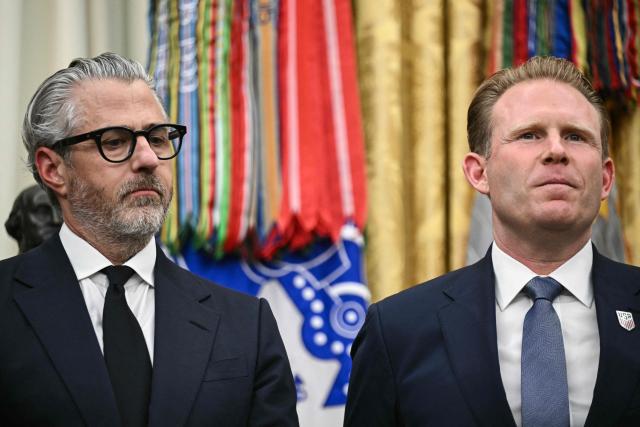 US businessman Casey Wasserman, chairperson of the 2028 Los Angeles Olympic Games, and Andrew Giuliani  look on as US President Donald Trump speaks during a meeting with travel industry executives in the Oval Office of the White House in Washington, DC, on September 2, 2026. (Photo by Brendan SMIALOWSKI / AFP)