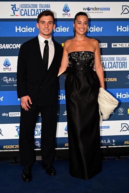 Juventus' Portuguese forward Francisco Conceicao (L) poses with his girlfriend Matilde Neiva upon arrival at the Italian Footballers' Association (AIC) gala and awards ceremony at La Scala Theatre in Milan, Italy on September 2, 2026. (Photo by Piero CRUCIATTI / AFP)