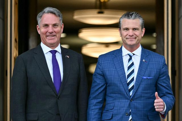 US Secretary of Defense Pete Hegseth (R) gives a thumbs up as he welcomes Australia Deputy Prime Minister and Minister of Defence Richard Marles (L) during an honor cordon ceremony at the Pentagon in Washington, DC, on September 2, 2026. (Photo by Kent NISHIMURA / AFP)