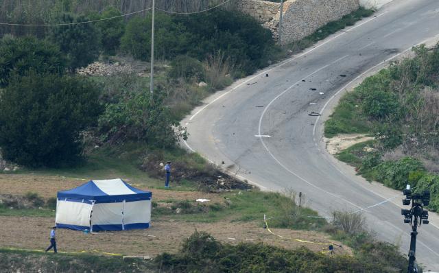 (FILES) A picture shows the crime scene a day after Maltese journalist Daphne Caruana Galizia was killed by a car bomb close to her home in Bidnija, Malta, on October 17, 2017. A Maltese court on September 2, 2026 aquitted tycoon Yorgen Fenech of orchestrating the brutal murder in 2017 of investigative reporter Daphne Caruana Galizia, according to media reports. (Photo by Matthew Mirabelli / AFP) / Malta OUT