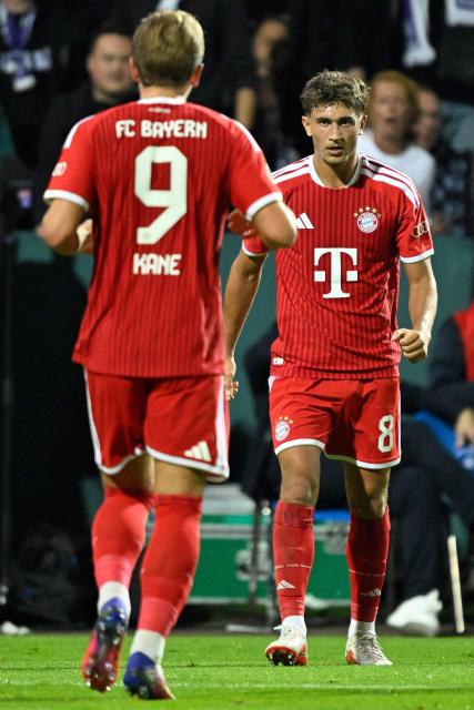 Bayern Munich's German midfielder #08 Tom Bischof (R) celebrates scoring the 1-2 goal with his teammate Bayern Munich's English forward #09 Harry Kane (L) during the German Cup (DFB Pokal) first round football match VfL Osnabrueck and FC Bayern Munich in Osnabrueck, western Germany on September 2, 2026. (Photo by INA FASSBENDER / AFP) / DFB REGULATIONS PROHIBIT ANY USE OF PHOTOGRAPHS AS IMAGE SEQUENCES AND QUASI-VIDEO.   ALTERNATIVE CROP