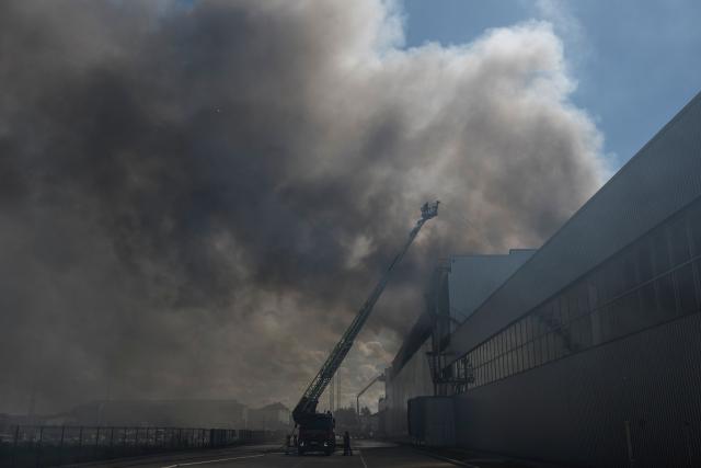 Ukrainian rescue personnel extinguish a fire in an auto parts warehouse following an air attack in Kyiv on September 2, 2026, amid the Russian invasion of Ukraine. (Photo by Vladyslav Musiienko / AFP)