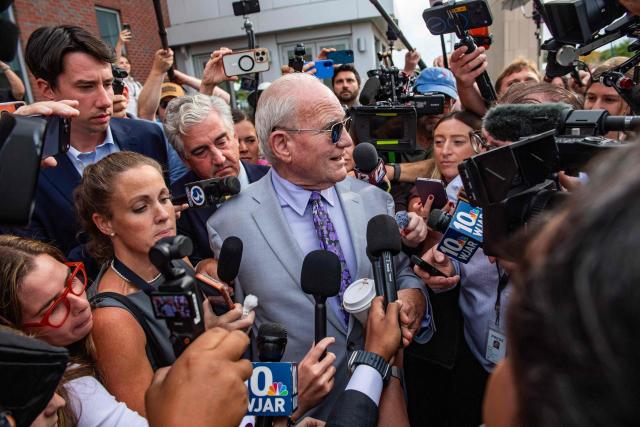 Media swarm Lindsay Clancy’s defense attorney Kevin Reddington as he leaves the courthouse during Clancy's trial at Plymouth Superior Court in Plymouth, Massachusetts, on September 2, 2026. Lindsay Clancy is on trial for the January 2023 strangulation deaths of her three young children. (Photo by JOSEPH PREZIOSO / AFP)