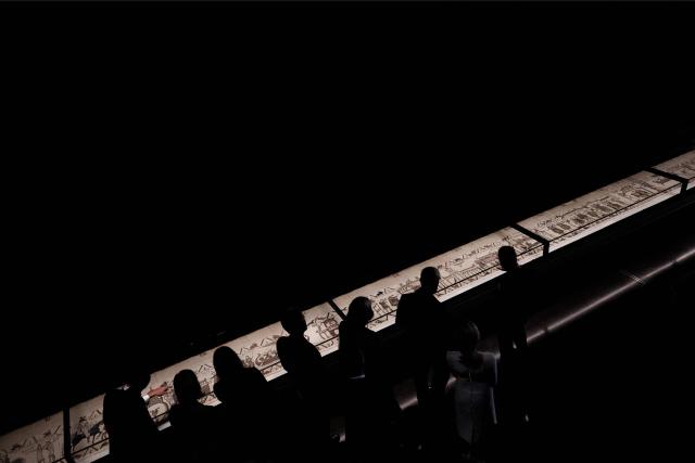 Britain's King Charles III and Britain's Queen Camilla alongside France's President Emmanuel Macron and his wife Brigitte Macron view sections of the Bayeux Tapestry during a preview event for the Bayeux Tapestry Exhibition, at the British Museum in London on September 2, 2026. (Photo by Jeanne Accorsini / POOL / AFP)
