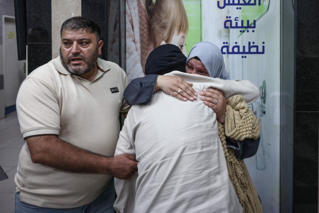 Relatives mourn during the funeral of two Palestinians killed in Al-Mughayyir, east of Ramallah, following an Israeli settlers attack follwed by  israeli army raid, at the Ramallah government hospital in the occupied West Bank on September 2, 2026. Violence by Israeli settlers towards Palestinians in the West Bank has persisted for years, often with little or no legal consequence, but recent months have seen a surge in attacks. More than 500,000 Israelis live in settlements in the Palestinian territory, which are illegal under international law, among some three million Palestinians. Israel has occupied the West Bank since 1967. (Photo by Zain JAAFAR / AFP)