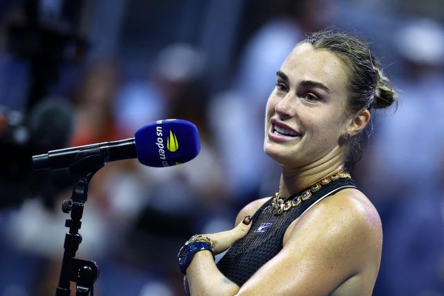 Belarus's Aryna Sabalenka speaks to the crowd after defeating Russia's Polina Iatcenko during the women's singles second round tennis match on day four of the US Open tennis tournament at the USTA Billie Jean King National Tennis Center in New York City on September 2, 2026. (Photo by CHARLY TRIBALLEAU / AFP)