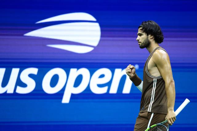 Spain's Carlos Alcaraz reacts after a point against Portugal's Jaime Faria during the men's singles second round tennis match on day four of the US Open tennis tournament at the USTA Billie Jean King National Tennis Center in New York City on September 2, 2026. (Photo by CHARLY TRIBALLEAU / AFP)
