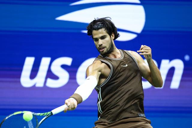 Spain's Carlos Alcaraz hits a return against Portugal's Jaime Faria during the men's singles second round tennis match on day four of the US Open tennis tournament at the USTA Billie Jean King National Tennis Center in New York City on September 2, 2026. (Photo by CHARLY TRIBALLEAU / AFP)