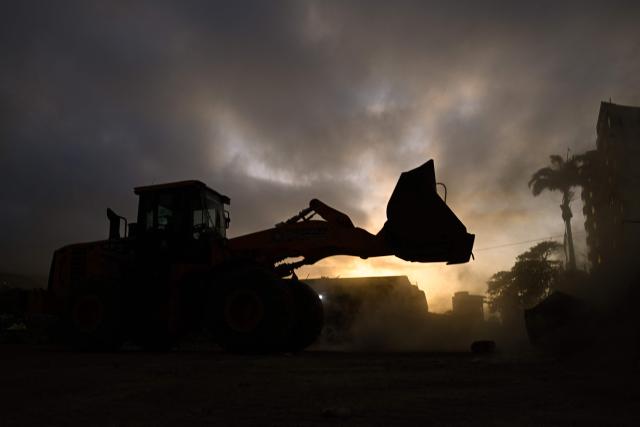 Heavy machinery clears the rubble of a collapsed building in Caraballeda, Venezuela, on September 2, 2026. The magnitude 7.2 and 7.5 tremors on June 24, 2026, devastated the coastal state of La Guaira, where at least 190 buildings fell apart. Venezuela's interim government reported 6,509 deaths on August 24, 2026, exactly two months after the twin earthquakes. (Photo by Federico PARRA / AFP)