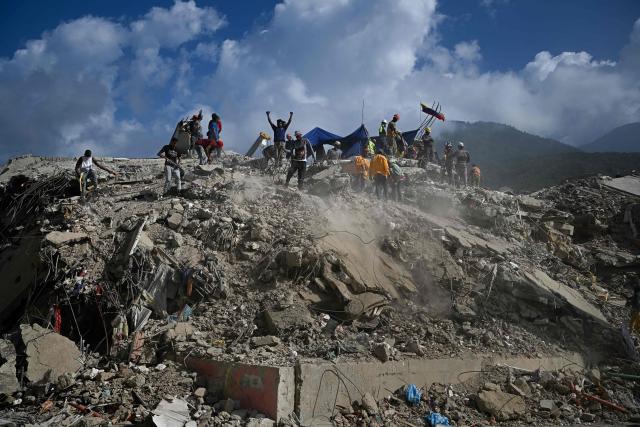 Rescue teams and volunteers search for bodies amid the rubble of a collapsed building in Caraballeda, Venezuela, on September 2, 2026. The magnitude 7.2 and 7.5 tremors on June 24, 2026, devastated the coastal state of La Guaira, where at least 190 buildings fell apart. Venezuela's interim government reported 6,509 deaths on August 24, 2026, exactly two months after the twin earthquakes. (Photo by Federico PARRA / AFP)