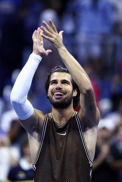 Spain's Carlos Alcaraz celebrates after victory during the men's singles second round tennis match against Portugal's Jaime Faria on day four of the US Open tennis tournament at the USTA Billie Jean King National Tennis Center in New York City on September 2, 2026. (Photo by CHARLY TRIBALLEAU / AFP)