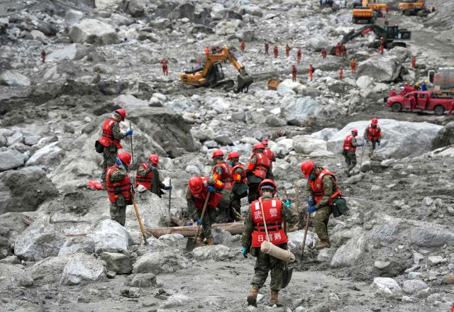 Rescue personnel search through the debris left by a mudslide in the hardest-hit area around the destroyed Gyirong Port in Gyirong County, in China’s western Tibet region on September 2, 2026. (Photo by CNS / AFP) / China OUT