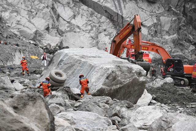 Rescue personnel search through the debris left by a mudslide in the area around the destroyed Gyirong Port in Gyirong County, in China’s western Tibet region on September 2, 2026. (Photo by CNS / AFP) / China OUT