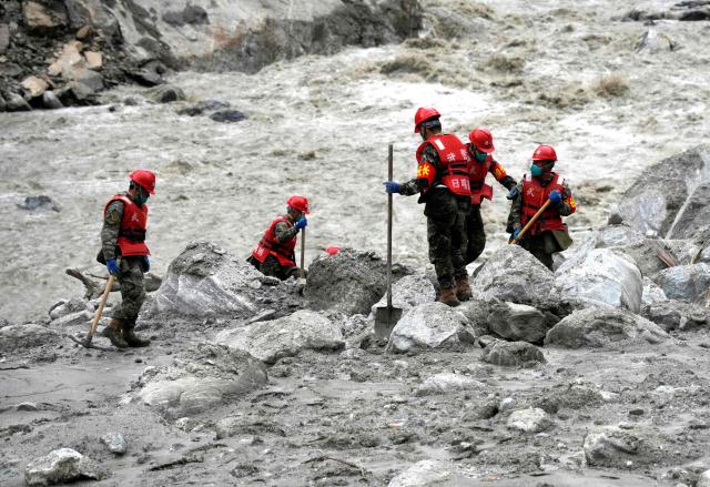 Rescue personnel search through the debris left by a mudslide in the hardest-hit area around the destroyed Gyirong Port in Gyirong County, in China’s western Tibet region on September 2, 2026. (Photo by CNS / AFP) / China OUT
