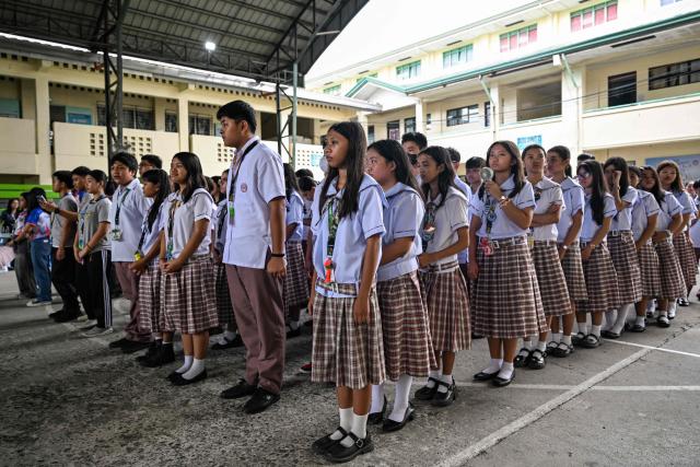 Students gather during a nationwide school drills to safeguard students from armed intruders, at a school in San Rafael, Bulacan on September 3, 2026. The drills came following a student livestreaming himself shooting another schoolmate dead before taking his own life at a high school in the Philippines on August 18, authorities said. (Photo by Jam STA ROSA / AFP)