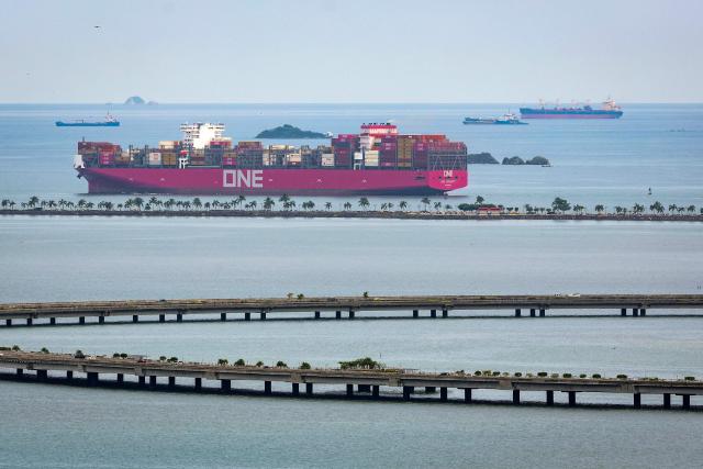 (FILES) The container ship One Serenity, sailing under the Liberian flag, leaves the Panama Canal in Panama City on August 26, 2026. El Nino is set to become "very strong" in the months ahead, with the weather phenomenon near certain to persist through to February, the United Nations' climate agency warned on September 3, 2026. (Photo by Martin BERNETTI / AFP)
