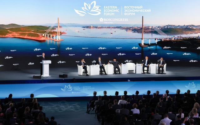 In this pool photograph distributed by the Russian state agency Sputnik, Russia's President Vladimir Putin gives a speech at the Eastern Economic Forum in Vladivostok on September 3, 2026. (Photo by Vyacheslav PROKOFYEV / POOL / AFP)