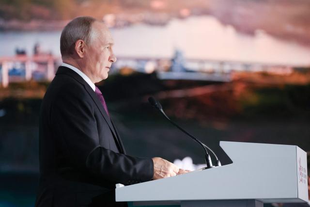 In this pool photograph distributed by the Russian state agency Sputnik, Russia's President Vladimir Putin gives a speech at the Eastern Economic Forum in Vladivostok on September 3, 2026. (Photo by Vyacheslav PROKOFYEV / POOL / AFP)