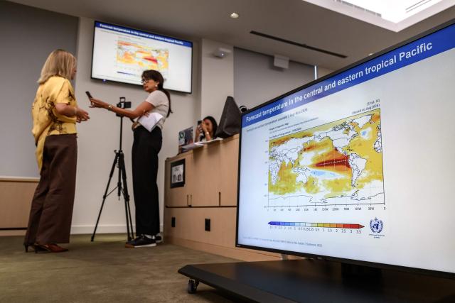World Meteorological Organization (WMO) Secretary-General Celeste Saulo gives an interview next to a presentation slide during a press conference on El Nino update, in Geneva on September 3, 2026. El Nino is set to become "very strong" in the months ahead, with the weather phenomenon near certain to persist through to February, the United Nations' climate agency warned. (Photo by Fabrice COFFRINI / AFP)
