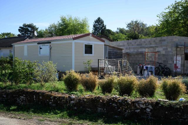 A photo shows a mobile home at a residence following the discovery of the bodies of four members of the same family, including two children aged six and nine, in Gy, eastern France on September 3, 2026. The bodies were found in the evening of September 2, 2026, after a man reportedly killed his two children and his mother-in-law before commiting suicide. According to people close to him, the man filmed the scene and sent the footage to his partner, with whom he was in the process of separating. (Photo by ARNAUD FINISTRE / AFP)