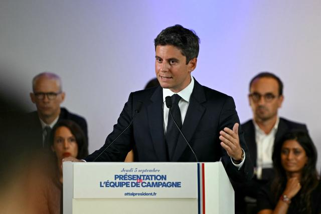 General Secretary of French centrist party Renaissance and upcoming presidential election candidate Gabriel Attal speaks during a press conference to present his campaign team (back) at the Renaissance headquarters in Paris on September 3, 2026. (Photo by LOU BENOIST / AFP)