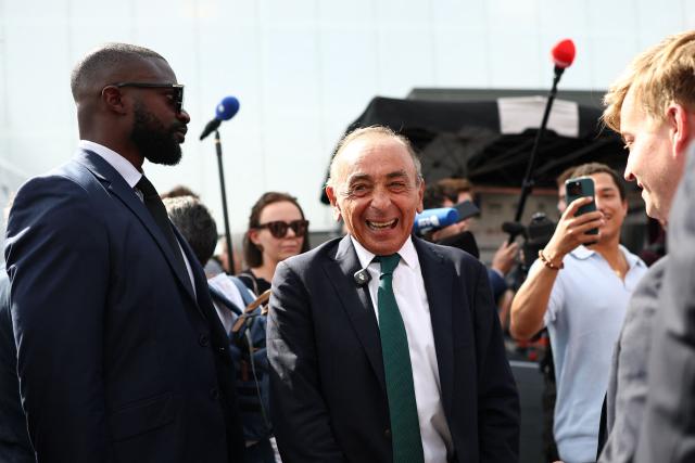 French far-right Reconquete! party leader Eric Zemmour (C) reacts as he visits the agricultural fair in Chalons-en-Champagne, northeastern France on September 3, 2026. (Photo by Sameer AL-DOUMY / AFP)