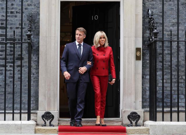 France's President Emmanuel Macron and his wife Brigitte Macron walk to a car after leaving from 10 Downing Street in central London on September 3, 2026, where they met with Britain's Prime Minister. (Photo by Ludovic MARIN / AFP)