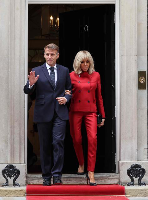 France's President Emmanuel Macron and his wife Brigitte Macron walk to a car after leaving from 10 Downing Street in central London on September 3, 2026, where they met with Britain's Prime Minister. (Photo by Ludovic MARIN / AFP)