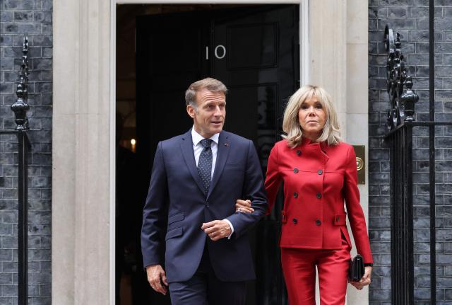 France's President Emmanuel Macron and his wife Brigitte Macron walk to a car after leaving from 10 Downing Street in central London on September 3, 2026, where they met with Britain's Prime Minister. (Photo by Ludovic MARIN / AFP)