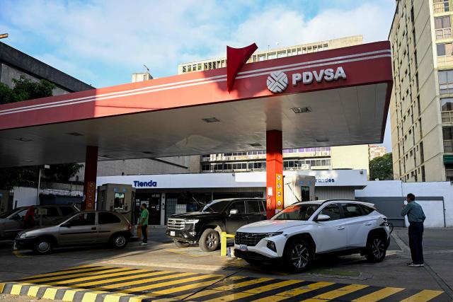 A driver refuels his car at a gas station in Caracas on September 3, 2026. (Photo by Federico PARRA / AFP)