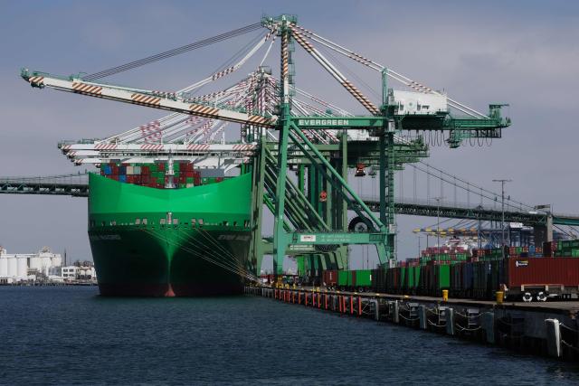 (FILES) A crane stands above the Ever Macro cargo container ship, owned by Evergreen Marine Corp., docked at the Evergreen shipping terminal at the Port of Los Angeles in Los Angeles, California on September 13, 2025. The US trade deficit in July 2026 widened to its largest since March 2025, government data showed on September 3, 2026, as imports climbed on the back of the booming AI tech build-out. US trade has seen wide fluctuations since President Donald Trump returned to the White House last year and rolled out sweeping tariffs on allies and competitors, in efforts to narrow the trade gap. (Photo by Patrick T. Fallon / AFP)