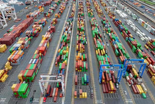 (FILES) This aerial view shows shipping containers stacked at the Port of Baltimore on April 10, 2025, in Baltimore, Maryland. The US trade deficit in July 2026 widened to its largest since March 2025, government data showed on September 3, 2026, as imports climbed on the back of the booming AI tech build-out. US trade has seen wide fluctuations since President Donald Trump returned to the White House last year and rolled out sweeping tariffs on allies and competitors, in efforts to narrow the trade gap. (Photo by Jim WATSON / AFP)