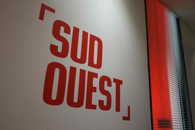 This photograph taken on September 3, 2026 shows a sign of the headquarters of French regional daily newspaper Sud Ouest, on the banks of the Garonne river in the Bastide district of Bordeaux, southwestern France. The parent company of the regional daily "Sud Ouest" has entered into “exclusive negotiations” for a takeover by the Belgian company Rossel, which already owns "La Voix du Nord" in France, the two groups announced on September 3, 2026. (Photo by Philippe LOPEZ / AFP)