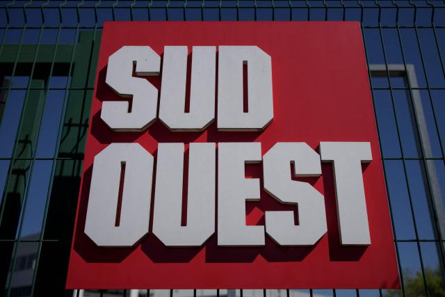 This photograph taken on September 3, 2026 shows a sign outside the printing house of French regional daily newspaper Sud Ouest, on the banks of the Garonne river in the Bastide district of Bordeaux, southwestern France. The parent company of the regional daily "Sud Ouest" has entered into “exclusive negotiations” for a takeover by the Belgian company Rossel, which already owns "La Voix du Nord" in France, the two groups announced on September 3, 2026. (Photo by Philippe LOPEZ / AFP)