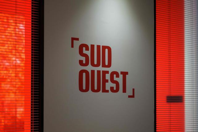 This photograph taken on September 3, 2026 shows a sign of the headquarters of French regional daily newspaper Sud Ouest, on the banks of the Garonne river in the Bastide district of Bordeaux, southwestern France. The parent company of the regional daily "Sud Ouest" has entered into “exclusive negotiations” for a takeover by the Belgian company Rossel, which already owns "La Voix du Nord" in France, the two groups announced on September 3, 2026. (Photo by Philippe LOPEZ / AFP)