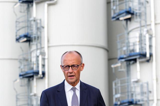 Chancellor and leader of the Christian Democratic Union (CDU) Friedrich Merz (L) and the State Premier of Saxony-Anhalt and lead candidate in the state election (unseen) address the media on September 3, 2026 in front of the Finnish UPM Biochemicals company in Leuna, eastern Germany, ahead of the Saxony-Anhalt state election on September 6. The 2026 Saxony-Anhalt state election to elect the 9th Landtag of Saxony-Anhalt will be held on September 6, 2026. (Photo by Jens SCHLUETER / AFP)