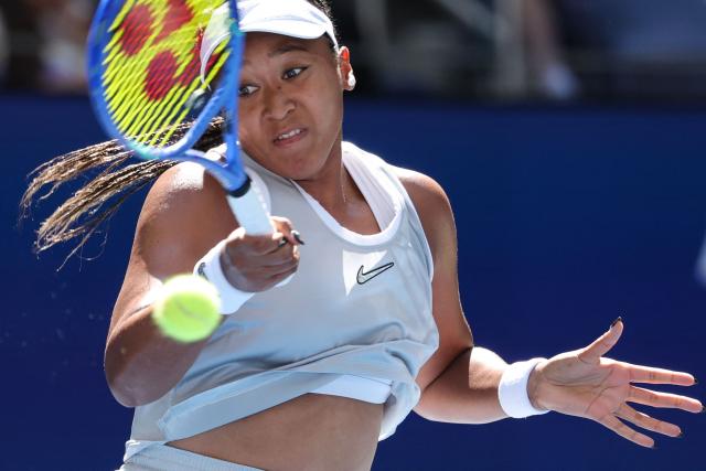 Japan's Naomi Osaka hits a return to Czech Republic's Katerina Siniakova during the women's singles second round tennis match on day five of the US Open tennis tournament at the USTA Billie Jean King National Tennis Center in New York on September 3, 2026. (Photo by KENA BETANCUR / AFP)