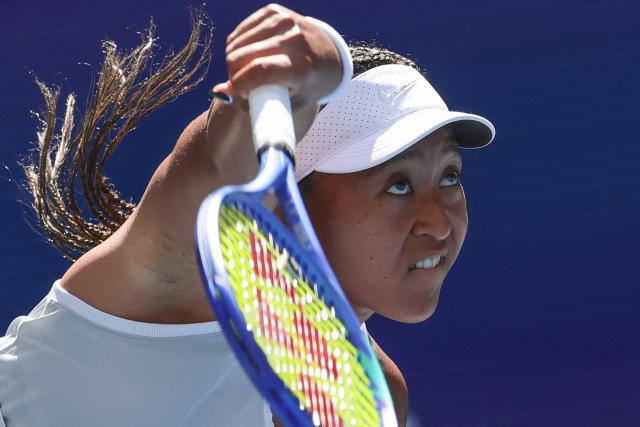 Japan's Naomi Osaka serves to Czech Republic's Katerina Siniakova during the women's singles second round tennis match on day five of the US Open tennis tournament at the USTA Billie Jean King National Tennis Center in New York on September 3, 2026. (Photo by KENA BETANCUR / AFP) / ALTERNATIVE CROP