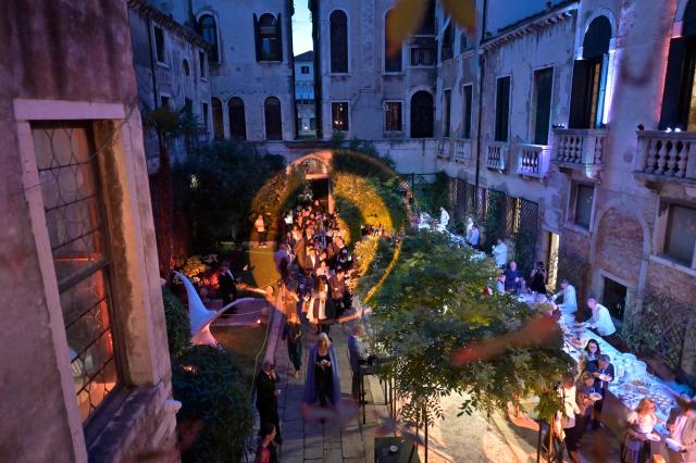 Guests attend a ball for the inauguration of the Palazzo Bragadin, a former residence of fashion designer Pierre Cardin turned into a museum, in Venice on September 3, 2026. The museum, which will open to the public on 12 September 2026, will house over 350 works (historic and contemporary creations, original drawings, haute couture pieces, furniture, lamps and design objects) spread over an area of almost one thousand square metres. (Photo by ANDREA PATTARO / AFP)