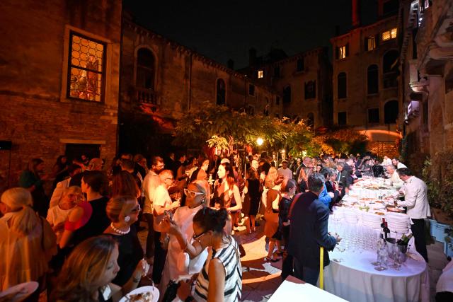 Guests attend a ball for the inauguration of the Palazzo Bragadin, a former residence of fashion designer Pierre Cardin turned into a museum, in Venice on September 3, 2026. The museum, which will open to the public on 12 September 2026, will house over 350 works (historic and contemporary creations, original drawings, haute couture pieces, furniture, lamps and design objects) spread over an area of almost one thousand square metres. (Photo by ANDREA PATTARO / AFP)