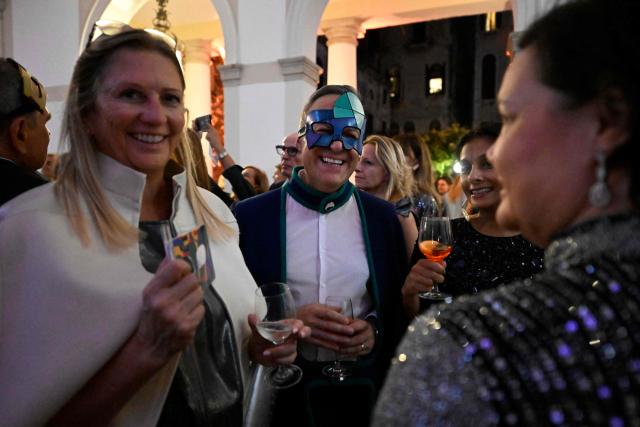 Guests attend a ball for the inauguration of the Palazzo Bragadin, a former residence of fashion designer Pierre Cardin turned into a museum, in Venice on September 3, 2026. The museum, which will open to the public on 12 September 2026, will house over 350 works (historic and contemporary creations, original drawings, haute couture pieces, furniture, lamps and design objects) spread over an area of almost one thousand square metres. (Photo by ANDREA PATTARO / AFP)
