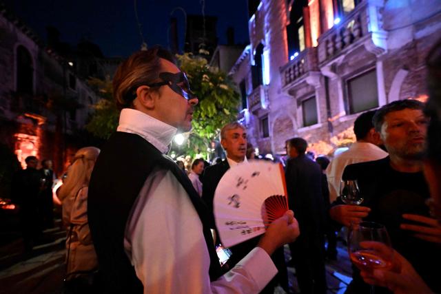 Guests attend a ball for the inauguration of the Palazzo Bragadin, a former residence of fashion designer Pierre Cardin turned into a museum, in Venice on September 3, 2026. The museum, which will open to the public on 12 September 2026, will house over 350 works (historic and contemporary creations, original drawings, haute couture pieces, furniture, lamps and design objects) spread over an area of almost one thousand square metres. (Photo by ANDREA PATTARO / AFP)