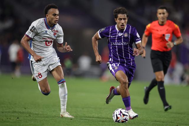 Toulouse's French midfielder #37 Ilyas Azizi (fron, R) runs with the ball during the French L1 football match between Toulouse Football Club (TFC) and Lille LOSC at the Stadium in Toulouse, southwestern France, on September 3, 2026. (Photo by Valentine CHAPUIS / AFP)