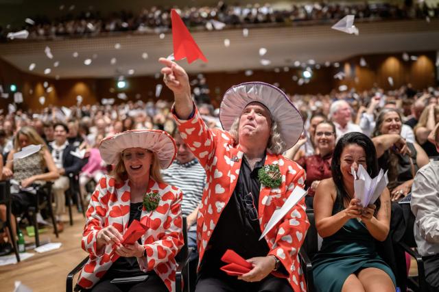 As part of a long-standing Ig Nobel tradition, members of the audience toss paper airplanes during the 2026 Ig Nobel Prize Ceremony in Zurich, on September 3, 2026. The Ig Nobel Prize is a parody of the Nobel Prize, which is awarded every autumn to celebrate ten unusual or trivial achievements in scientific research. (Photo by Fabrice COFFRINI / AFP)