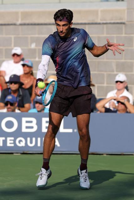 Italy's Lorenzo Musetti hits a return to Australia's Dane Sweeny during their men's singles second round tennis match on day five of the US Open tennis tournament at the USTA Billie Jean King National Tennis Center in New York City on September 3, 2026. (Photo by KENA BETANCUR / AFP)