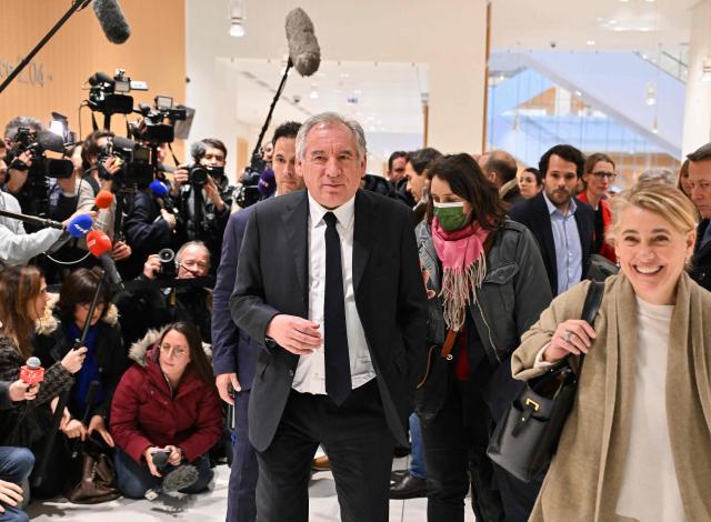 (FILES) Head of French MoDem centrist party Francois Bayrou (C) leaves the Paris Judicial court, northern district of Paris on February 5, 2024, on the day of the decision of Paris court in his trial and ten other centrist executives and elected representatives, on charges of complicity in the misappropriation of public funds in a scandal over MoDem European parliamentary assistants. The appeal trial of François Bayrou along with ten other people, for alleged complicity in the misappropriation of public funds in a scandal over MoDem European parliamentary assistants will run from September 9 to October 5, 2026. (Photo by Miguel MEDINA / AFP)