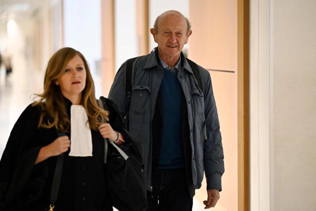 (FILES) French politician, former vice-president of the centrist Democratic Movement (MoDem) party and MEP, Jean-Luc Bennahmias (C) arrives for the start of his trial at the Judicial court of Paris in Batignolles, a northern district of Paris on October 16, 2023. The appeal trial of François Bayrou along with ten other people, for alleged complicity in the misappropriation of public funds in a scandal over MoDem European parliamentary assistants will run from September 9 to October 5, 2026. (Photo by JULIEN DE ROSA / AFP)