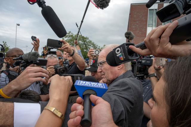 Kevin Reddington, defense attorney for Lindsay Clancy, is surrounded by news reporters while leaving the courthouse as the jury deliberation phase continues in Lindsay Clancy's murder trial at the Plymouth County Superior Court in Plymouth, Massachusetts, on September 3, 2026. The defense for Lindsay Clancy, the US mother accused of murdering her three children, on Thursday accused a single holdout juror of blocking a verdict in the high-profile trial. Judge William Sullivan will hold an inquiry on Friday as jurors return for a seventh day of deliberations, after roughly 36 hours spent trying to reach a unanimous verdict. (Photo by Rick Friedman / AFP)