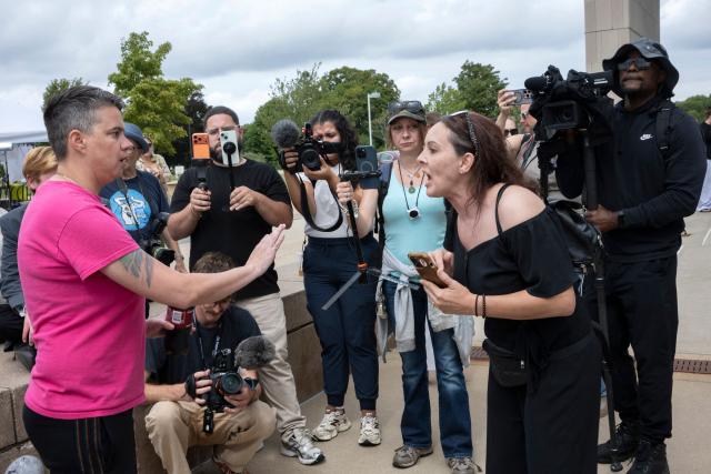 Two women argue outside the courthouse as the jury deliberation phase continues in Lindsay Clancy's murder trial at the Plymouth County Superior Court in Plymouth, Massachusetts, on September 3, 2026. The defense for Lindsay Clancy, the US mother accused of murdering her three children, on Thursday accused a single holdout juror of blocking a verdict in the high-profile trial. Judge William Sullivan will hold an inquiry on Friday as jurors return for a seventh day of deliberations, after roughly 36 hours spent trying to reach a unanimous verdict. (Photo by Rick Friedman / AFP)