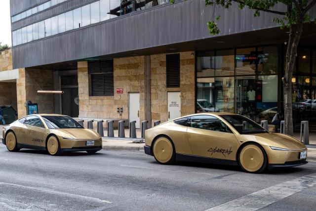 A couple of Tesla's "Cybercab" ride in downtown Austin, Texas, on September 3, 2026. Tesla is launching the "Cybercab" which is a taxi with no steering wheel or pedals, designed purely for autonomy. (Photo by RONALDO SCHEMIDT / AFP)